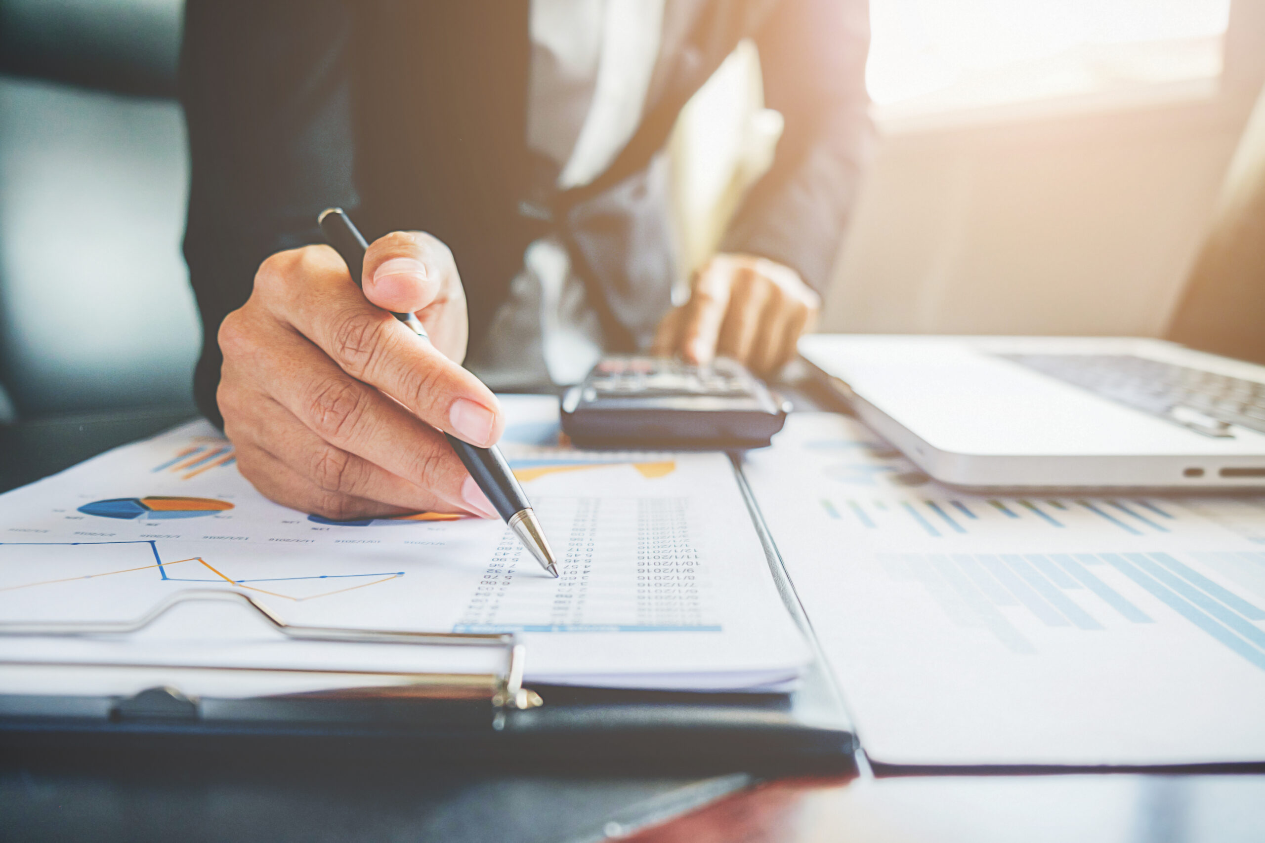 Tax and business service documents on a desk